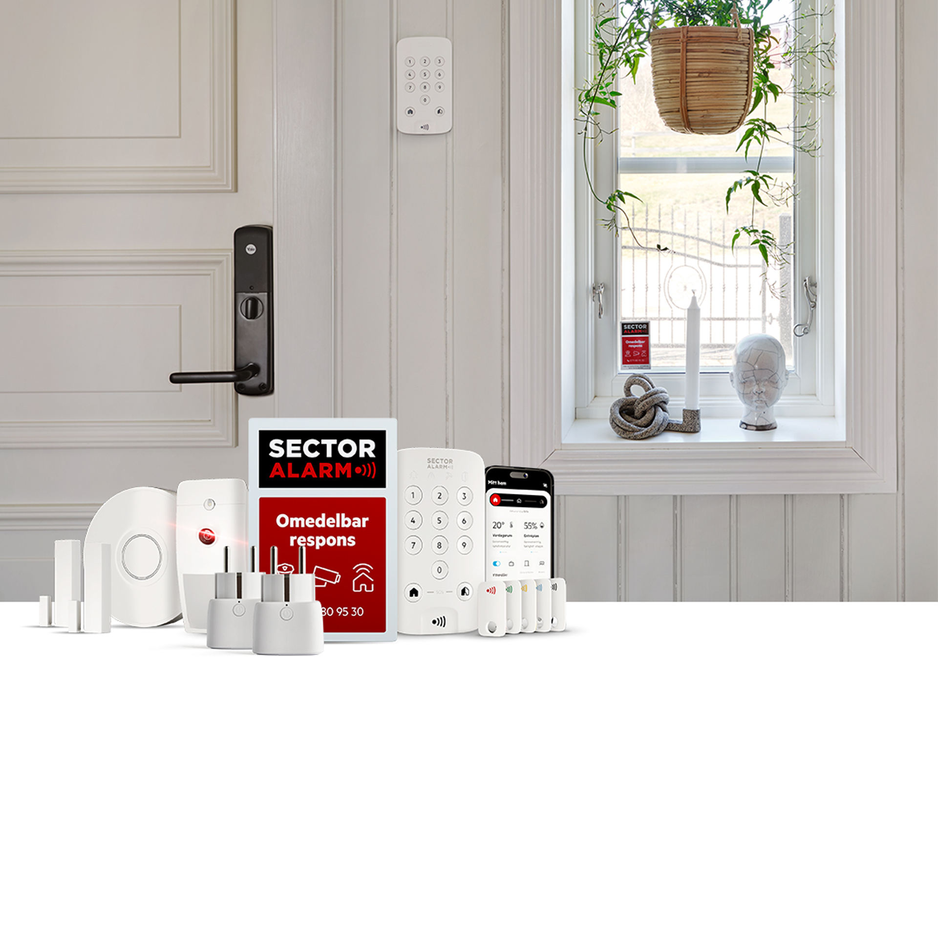 Komponenter på ett bord i hemlarmspaketet.